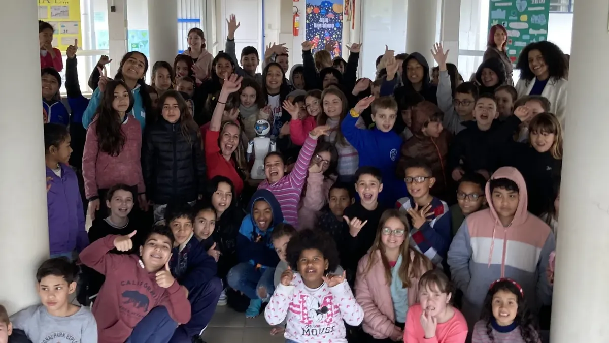 Group of students and educators with Beo the robot