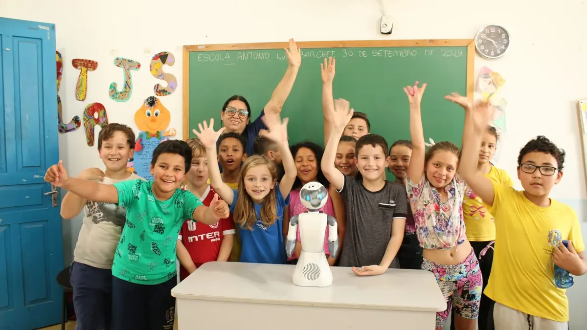 Students in a classroom interacting with Beo the educational robot